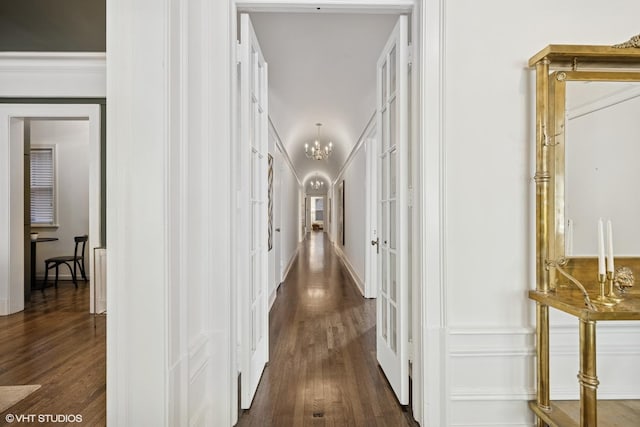 3120 N Sheridan Rd Unit A1, Chicago, IL 60657 - hallway featuring dark wood-type flooring and a chandelier