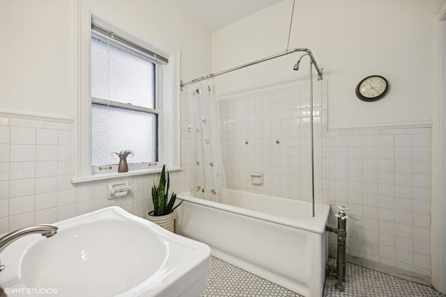 3120 N Sheridan Rd Unit A1, Chicago, IL 60657 - full bathroom with tile walls, shower / bath combo with shower curtain, tile patterned floors, a sink, and wainscoting