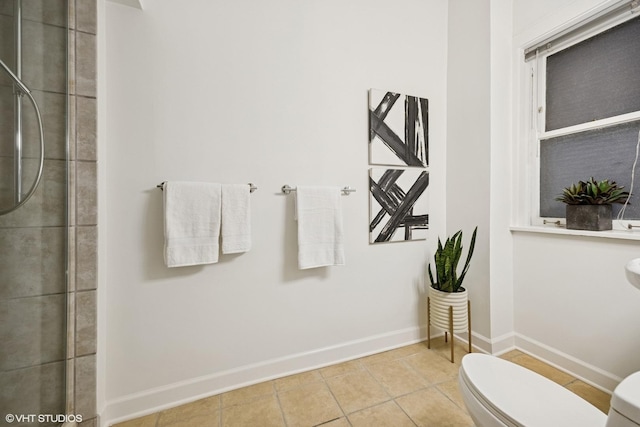 3120 N Sheridan Rd Unit A1, Chicago, IL 60657 - bathroom featuring toilet, tile patterned floors, baseboards, and tiled shower