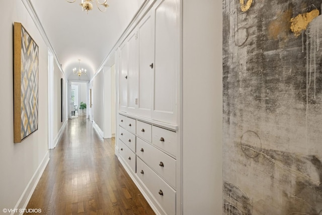 3120 N Sheridan Rd Unit A1, Chicago, IL 60657 - hallway with a chandelier, wood finished floors, and baseboards