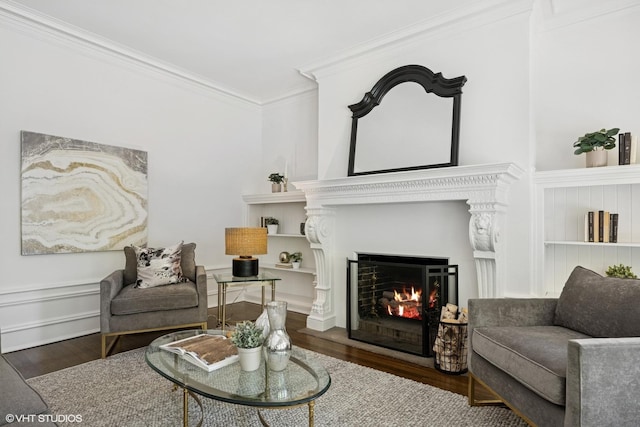 3120 N Sheridan Rd Unit A1, Chicago, IL 60657 - living area featuring wood finished floors, crown molding, and a warm lit fireplace