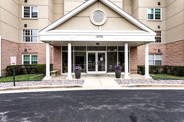 13750 S Bristlecone Dr Unit 408, Plainfield, IL 60544 - property entrance featuring french doors and stone siding
