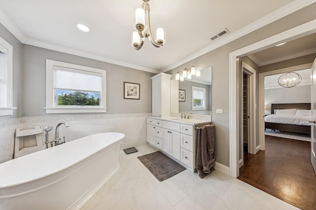 3828 Venard Rd, Downers Grove, IL 60515 - full bathroom with a chandelier, healthy amount of natural light, a soaking tub, vanity, and tile walls