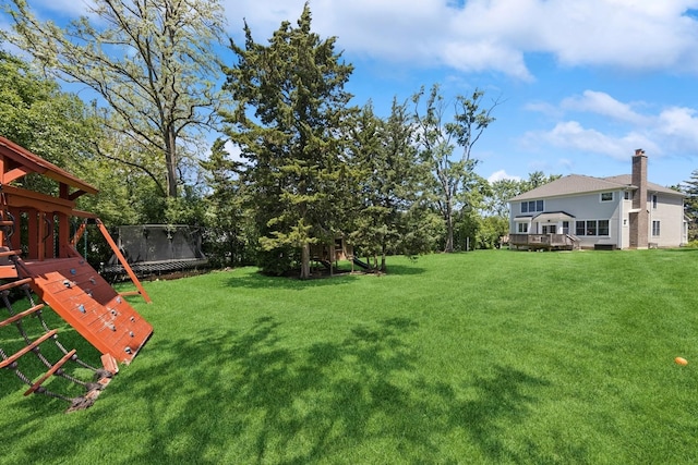 3828 Venard Rd, Downers Grove, IL 60515 - view of green lawn featuring a trampoline, a playground, and a deck