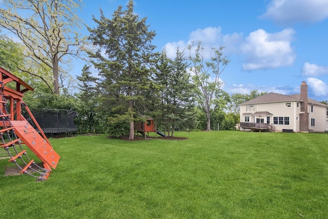 3828 Venard Rd, Downers Grove, IL 60515 - view of green lawn with a trampoline, a playground, and a deck