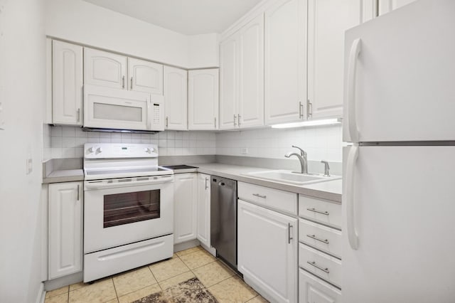 1550 N Lake Shore Dr Unit 7D, Chicago, IL 60610 - kitchen featuring white appliances, a sink, white cabinetry, backsplash, and light countertops