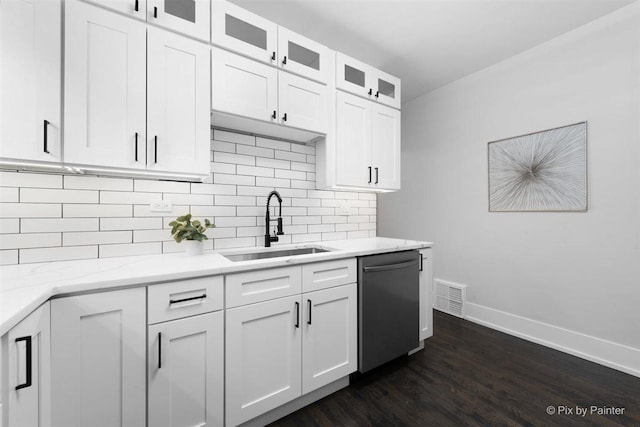 4846 W Roscoe St, Chicago, IL 60641 - kitchen featuring dishwasher, a sink, baseboards, dark wood finished floors, and tasteful backsplash