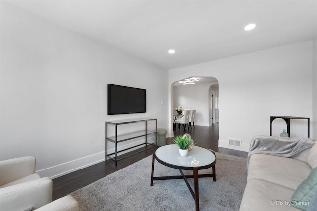 4846 W Roscoe St, Chicago, IL 60641 - living room with arched walkways, wood finished floors, baseboards, and recessed lighting