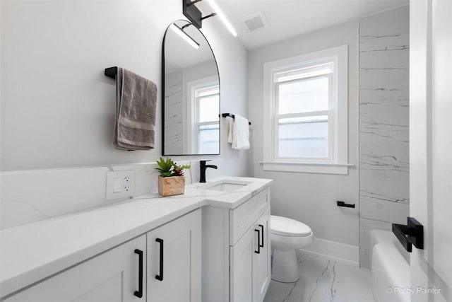 4846 W Roscoe St, Chicago, IL 60641 - full bathroom featuring marble finish floors, vanity, toilet, and baseboards