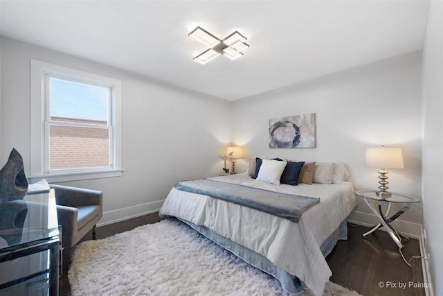 4846 W Roscoe St, Chicago, IL 60641 - bedroom featuring baseboards and wood finished floors