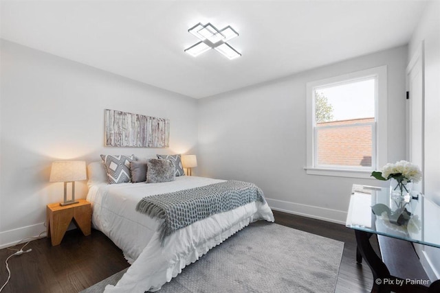 4846 W Roscoe St, Chicago, IL 60641 - bedroom featuring baseboards and wood finished floors