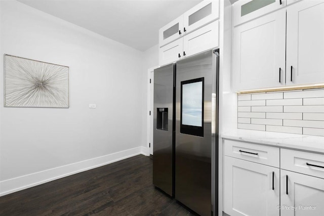 4846 W Roscoe St, Chicago, IL 60641 - kitchen with stainless steel refrigerator with ice dispenser, baseboards, dark wood-style floors, light stone counters, and decorative backsplash