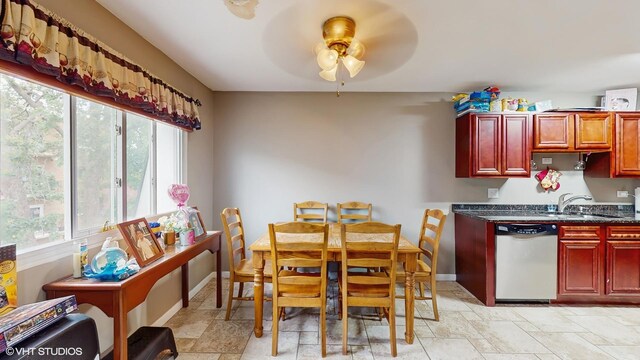 9621 S Karlov Ave Unit 303, Oak Lawn, IL 60453 - kitchen with stainless steel dishwasher, ceiling fan, reddish brown cabinets, and a sink
