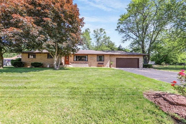 480 W Kennedy Rd, Braidwood, IL 60408 - single story home with a garage, driveway, and brick siding