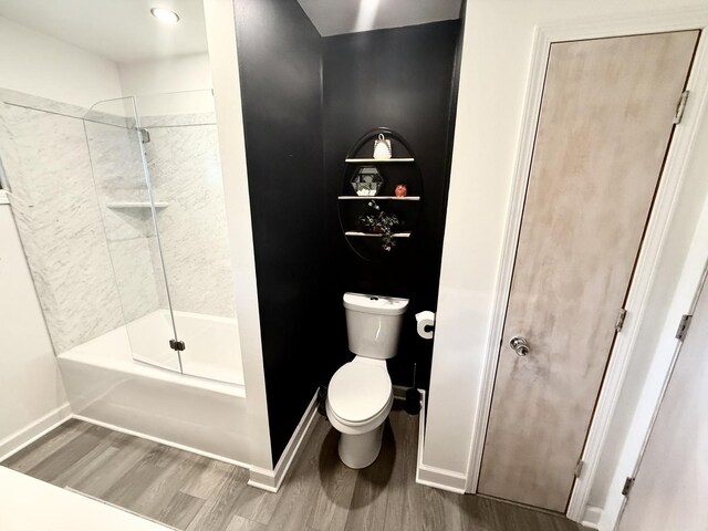 480 W Kennedy Rd, Braidwood, IL 60408 - bathroom with wood finished floors, baseboards, toilet, and shower / bath combination
