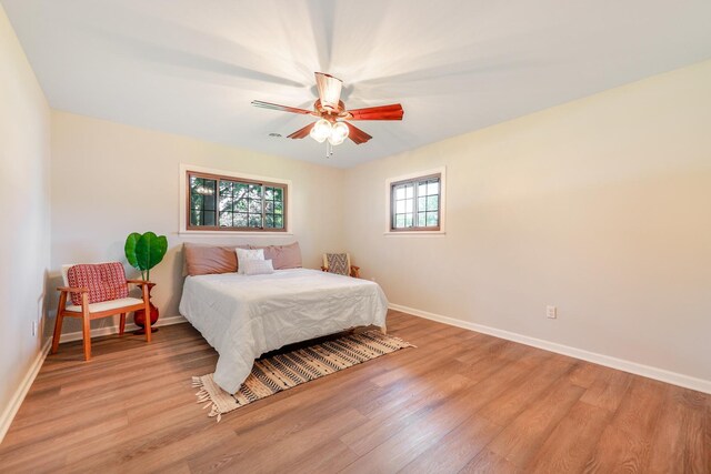 480 W Kennedy Rd, Braidwood, IL 60408 - bedroom with baseboards, light wood-type flooring, and a ceiling fan