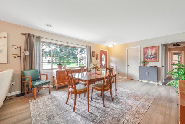 480 W Kennedy Rd, Braidwood, IL 60408 - dining area with light wood-style flooring and baseboards