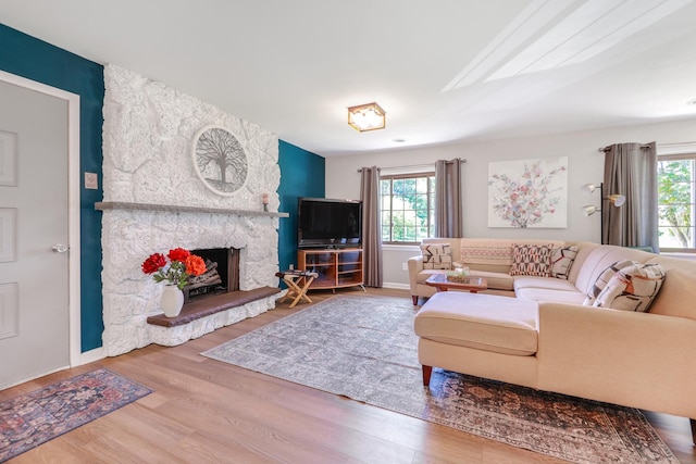 480 W Kennedy Rd, Braidwood, IL 60408 - living area with healthy amount of natural light, a fireplace, and wood finished floors