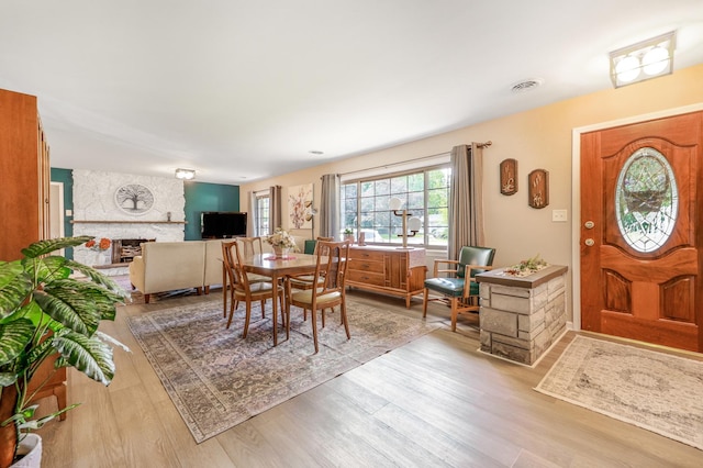 480 W Kennedy Rd, Braidwood, IL 60408 - dining room featuring wood finished floors and a stone fireplace