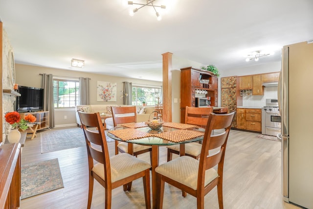 480 W Kennedy Rd, Braidwood, IL 60408 - dining room featuring plenty of natural light, light wood-style flooring, and baseboards