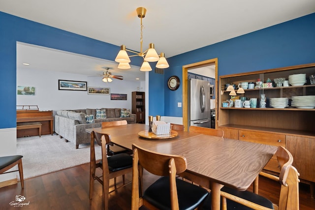 1245 W Lotus Ln, Kankakee, IL 60901 - dining area with ceiling fan, dark wood finished floors, and a chandelier