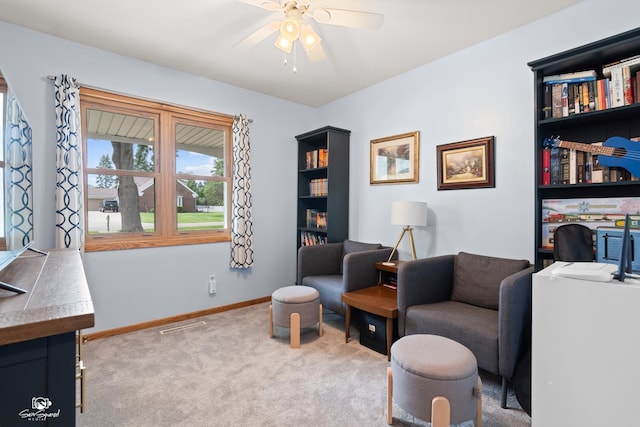 1245 W Lotus Ln, Kankakee, IL 60901 - sitting room with carpet floors, a ceiling fan, and baseboards