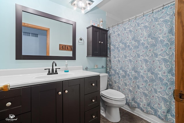 1245 W Lotus Ln, Kankakee, IL 60901 - bathroom with toilet, vanity, tile patterned flooring, and curtained shower