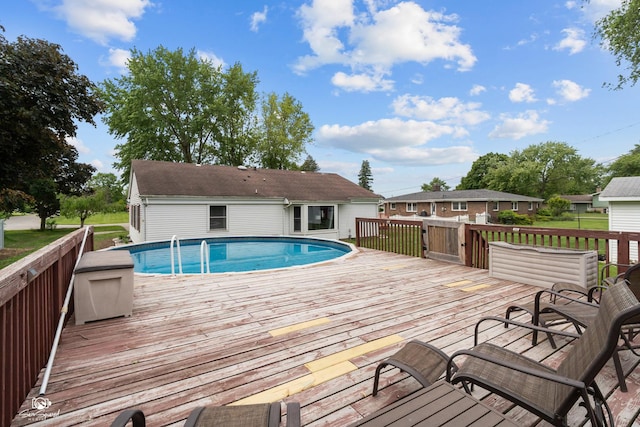1245 W Lotus Ln, Kankakee, IL 60901 - swimming pool featuring a wooden deck
