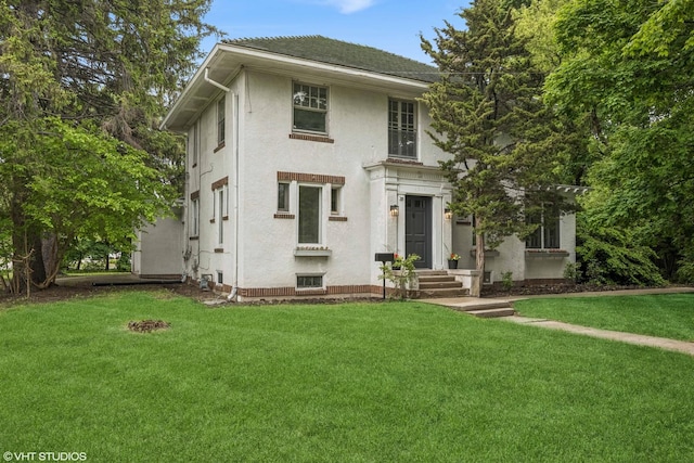 1310 Larkin Ave, Elgin, IL 60123 - view of front of property featuring stucco siding and a front lawn