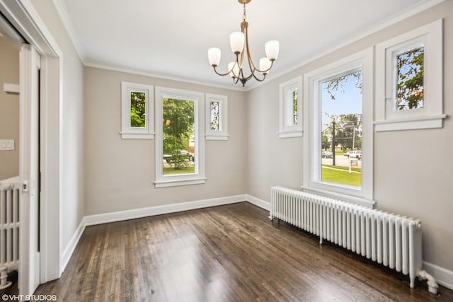 1310 Larkin Ave, Elgin, IL 60123 - unfurnished room featuring radiator heating unit, ornamental molding, a chandelier, baseboards, and dark wood-style flooring