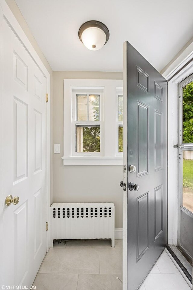 1310 Larkin Ave, Elgin, IL 60123 - foyer with radiator and light tile patterned floors
