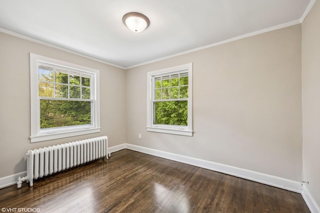 1310 Larkin Ave, Elgin, IL 60123 - empty room featuring radiator, healthy amount of natural light, baseboards, crown molding, and dark wood-style floors