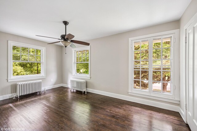 1310 Larkin Ave, Elgin, IL 60123 - unfurnished room featuring radiator heating unit, wood finished floors, a ceiling fan, and baseboards