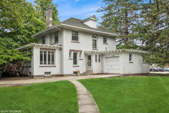 1310 Larkin Ave, Elgin, IL 60123 - back of property with a chimney, a lawn, stucco siding, a garage, and entry steps