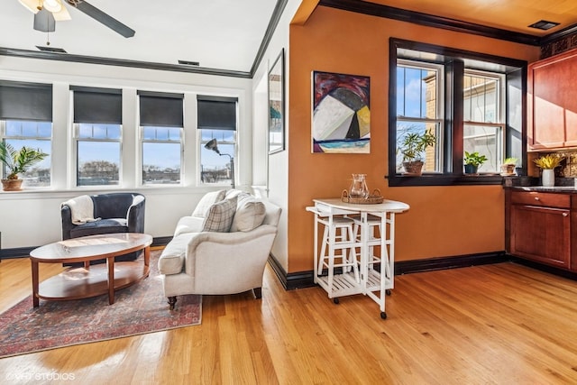 4337 N Troy St Unit 3W, Chicago, IL 60618 - living area featuring crown molding, plenty of natural light, light wood finished floors, and baseboards