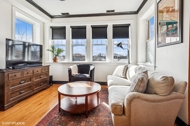 4337 N Troy St Unit 3W, Chicago, IL 60618 - living area featuring crown molding and light wood-style flooring