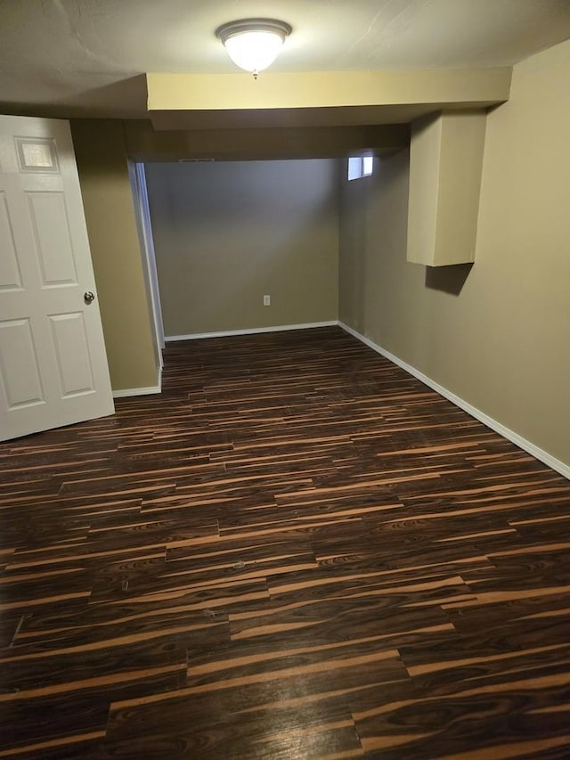 17506 Bernadine St, Lansing, IL 60438 - finished basement with dark wood-style floors and baseboards
