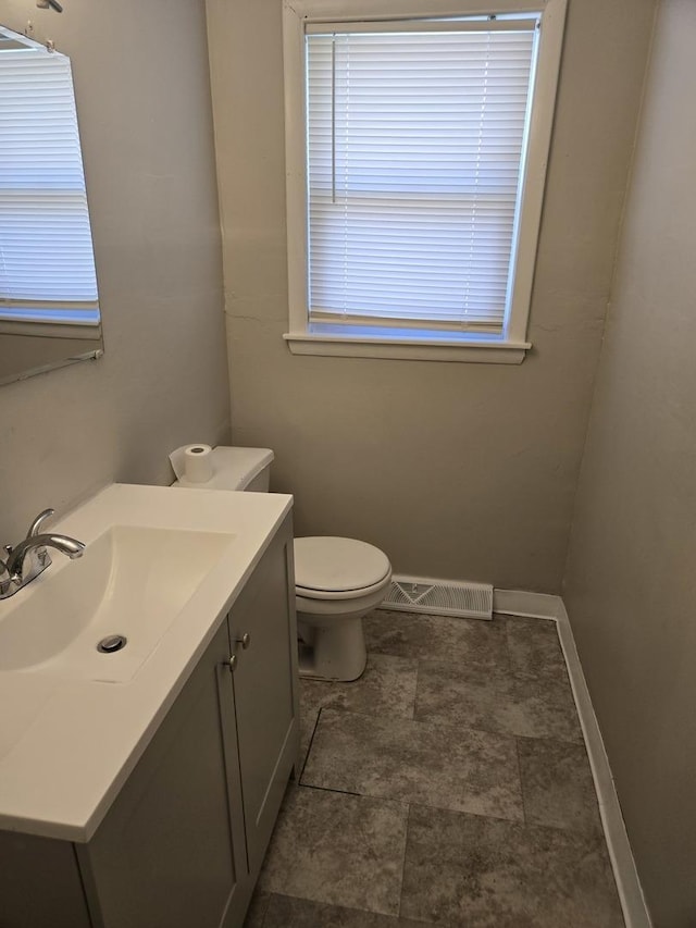 17506 Bernadine St, Lansing, IL 60438 - half bath featuring vanity, baseboards, and toilet