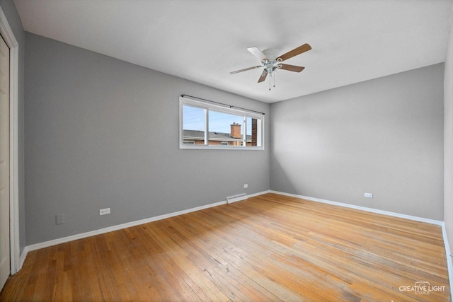8044 W Lyons St Unit B, Niles, IL 60714 - empty room featuring a ceiling fan, light wood-style floors, and baseboards