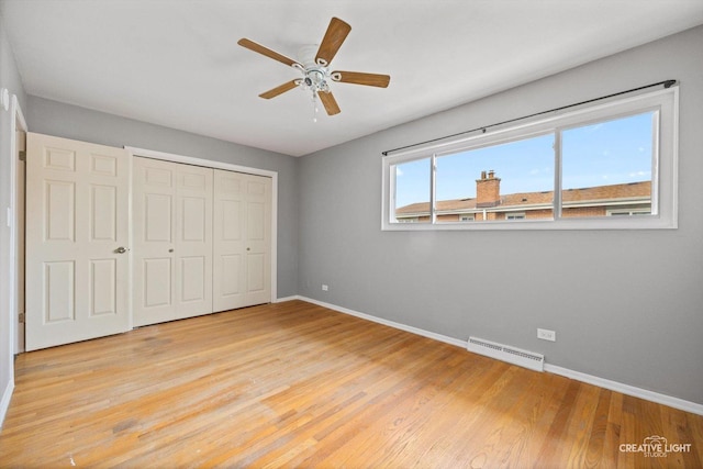 8044 W Lyons St Unit B, Niles, IL 60714 - unfurnished bedroom featuring baseboards, light wood-style floors, a closet, and ceiling fan