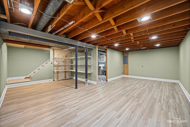 8044 W Lyons St Unit B, Niles, IL 60714 - finished below grade area with baseboards, wood finished floors, and stairs