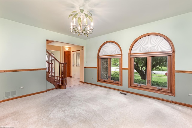 18633 Swan Dr, Mokena, IL 60448 - empty room featuring a chandelier, carpet flooring, stairway, and baseboards