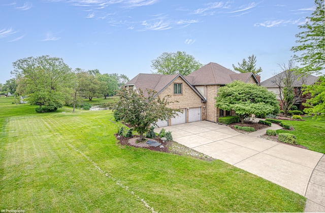 18633 Swan Dr, Mokena, IL 60448 - view of front facade featuring concrete driveway, a front yard, an attached garage, and brick siding