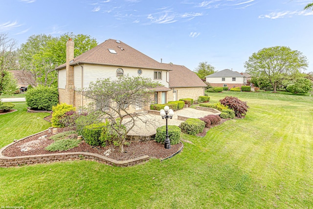 18633 Swan Dr, Mokena, IL 60448 - rear view of property with a patio area, a chimney, a lawn, and roof with shingles