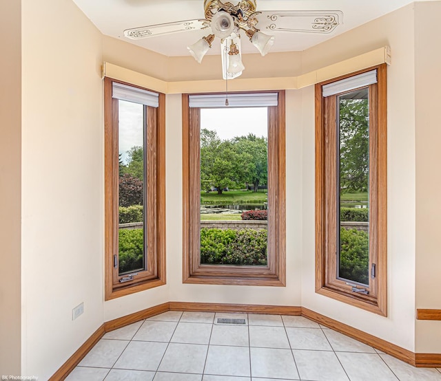 18633 Swan Dr, Mokena, IL 60448 - empty room featuring a ceiling fan, baseboards, and light tile patterned floors