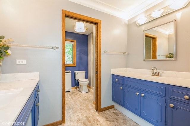 69 Graymoor Ln, Olympia Fields, IL 60461 - bathroom with two vanities, crown molding, toilet, and baseboards