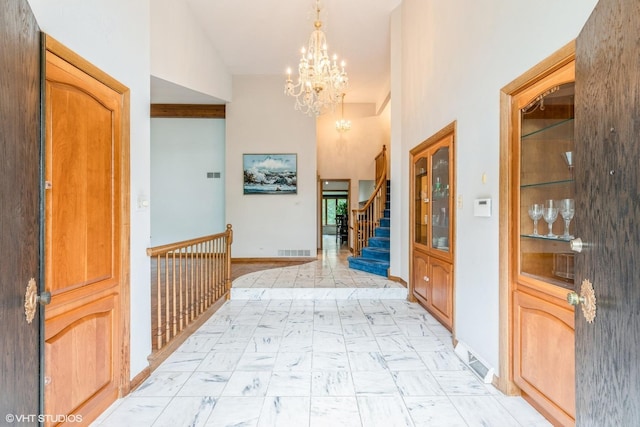 69 Graymoor Ln, Olympia Fields, IL 60461 - entryway with a chandelier, light marble finish flooring, and stairs