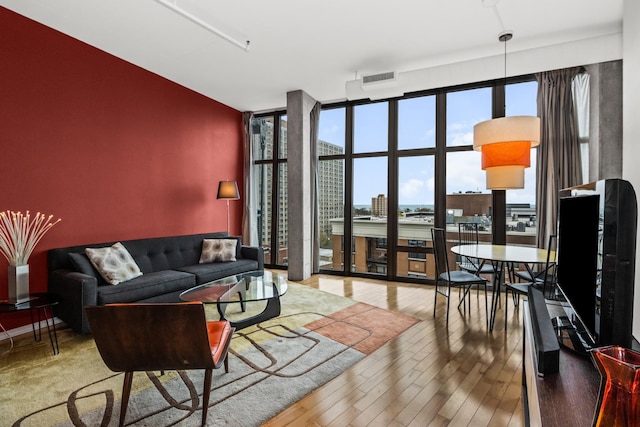 1000 W Leland St Unit 9B, Chicago, IL 60640 - living area with floor to ceiling windows and wood-type flooring