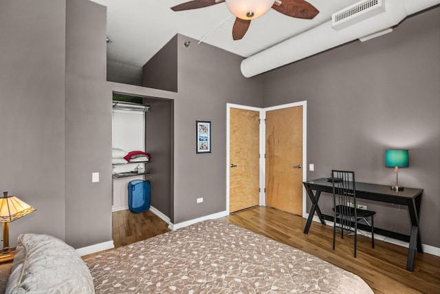 1000 W Leland St Unit 9B, Chicago, IL 60640 - bedroom featuring wood finished floors, baseboards, an office area, a ceiling fan, and a closet