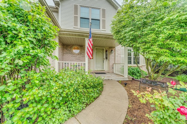 3368 Charlemaine Dr, Aurora, IL 60504 - property entrance featuring brick siding and covered porch